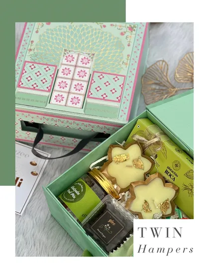 Here’s a look at our twin box hamper, a unique Diwali gift box with a drawer design. It’s filled with sweets and festive treats, making it a truly special gift.
