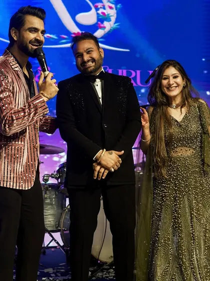 Sharing a laugh with the happy couple on stage. My goal is to make them feel like the stars of the show.