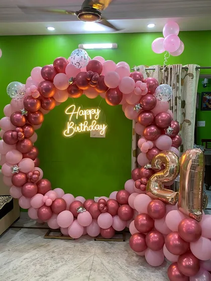 A full view of the 21st birthday setup, including foil number balloons.