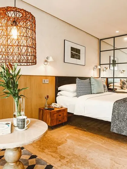 I designed this room as a personal sanctuary. Notice the blend of natural textures like the wicker lamp with modern comforts, creating a space you may never want to leave.