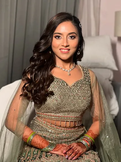 A confident and happy portrait of Apurva, ready for her Sangeet.