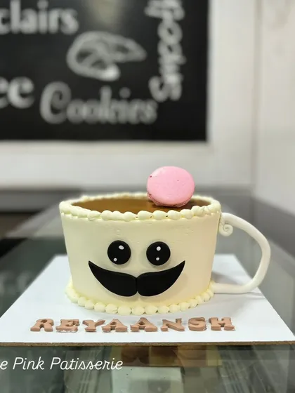 A cute coffee cup cake with a mustache. This fun, sculpted cake is a great way to celebrate a coffee lover's birthday.