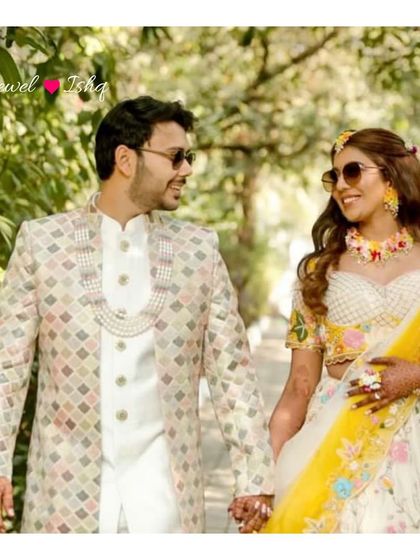 A happy couple shot from a real Haldi ceremony. The bride wears my custom floral jewellery, and the groom complements her with a pearl necklace.