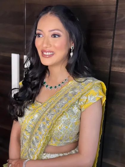 A final shot of this sunny and cheerful look. The makeup is designed to enhance her natural beauty and complement the bright outfit.