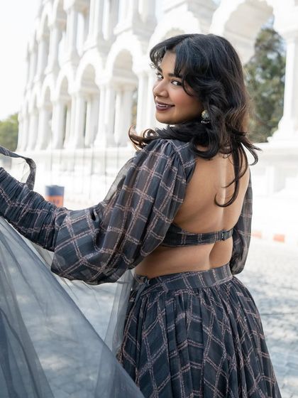 A closer look at the playful back of our grey printed lehenga. It's all about fun, fashion-forward details.