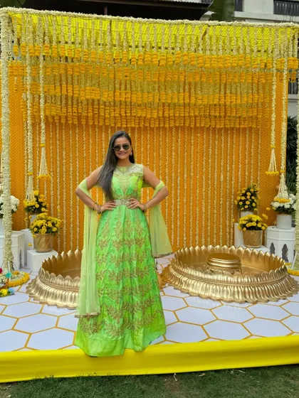 A full-length shot of my green and gold Anarkali, a perfect choice for a daytime Haldi function.