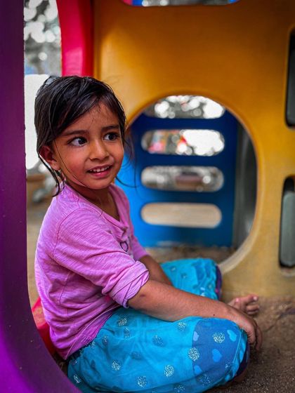 Our events are for the whole family. We love creating a space where kids can play and have fun while the adults connect with the fitness community. This little one is enjoying the play area at our Garage Sale.