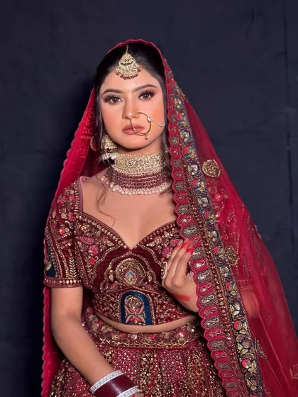 Another beautiful portrait of the bride, showcasing the complete look with her dupatta.