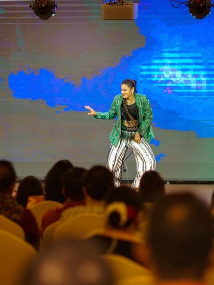 Performing on stage in front of a large audience. This wide shot shows how my solo performances can command a large stage and captivate a full house.