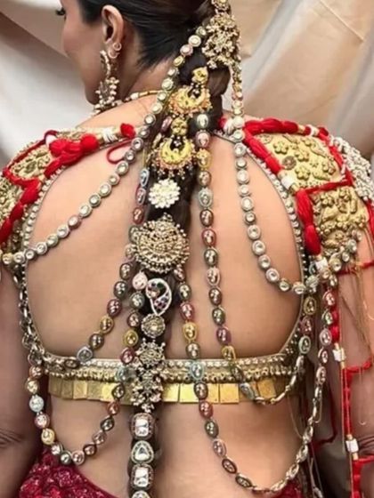 A detailed close-up of the incredible craftsmanship of the real jewelry woven into this bridal braid.