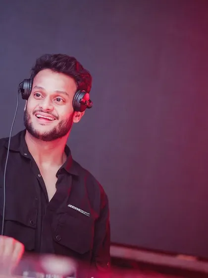 A shot of me in the zone. This is the smile you see when the mix is perfect and the crowd is roaring. This isn't just a job, it's my passion.