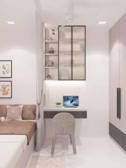 This angle highlights the room's layout, showing the relationship between the bed, the study desk, and the full-height wardrobe. The gallery wall of framed art adds a personal touch, making the space feel truly unique.