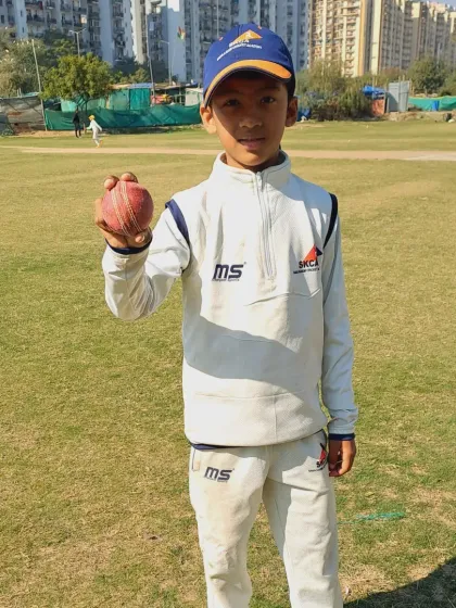 Vedagya, one of our key bowlers, proudly displays the ball after his match-winning spell for the SKCA Tigers.