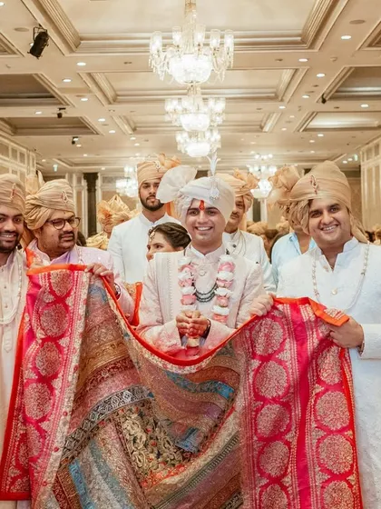 A playful and traditional 'baraat swaagat' where the bride's family welcomes the groom's procession with fun and games.
