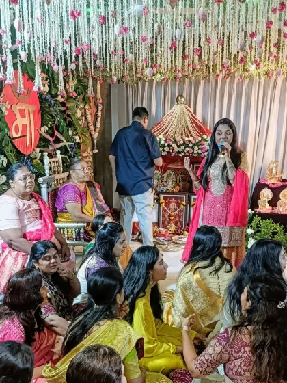 Here I am, mic in hand, guiding the flow of a traditional Simant ceremony. I make sure to explain the significance of the rituals while keeping the atmosphere light and celebratory.