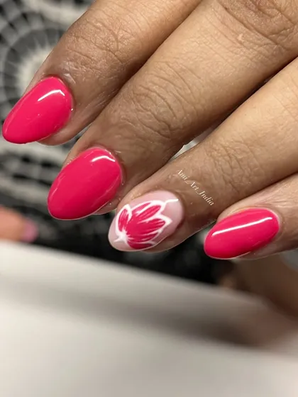 A simple yet beautiful hand-painted lotus design on an accent nail.
