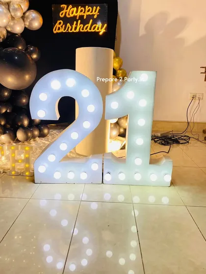 My 21st birthday decorations range from bold and modern to soft and elegant. I use marquee numbers, custom backdrops, and sophisticated balloon arrangements to mark this special occasion.