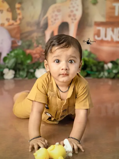 A close-up of our little explorer on the move. His determined expression shows he's ready to discover all the secrets of the jungle.