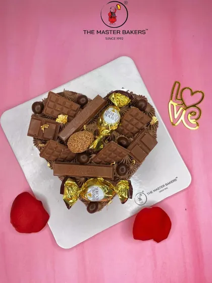 For the ultimate chocolate lover, this heart-shaped cake is loaded with an assortment of chocolates like Ferrero Rocher and KitKat. It's a truly decadent way to celebrate your love.