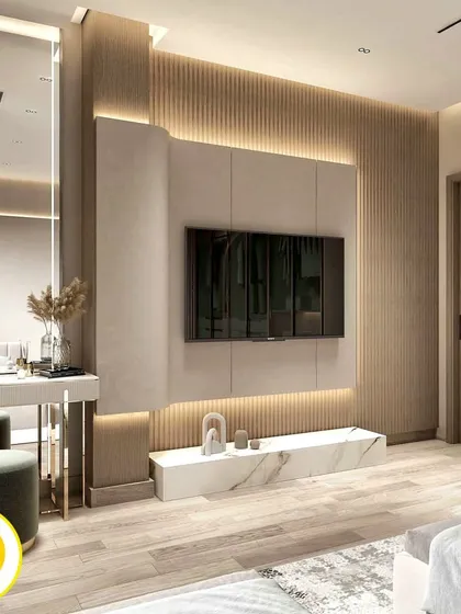 We designed this premium master bedroom to be a sanctuary of comfort and style. The space features a floor-to-ceiling fluted wood panel behind the TV, a marble-finish console, and a chic integrated dressing table, all tied together with warm, ambient lighting.