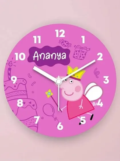 Make telling time fun with a personalized kids' clock. This bright pink Peppa Pig design, customized with the name 'Ananya', is a perfect addition to a child's bedroom or playroom.