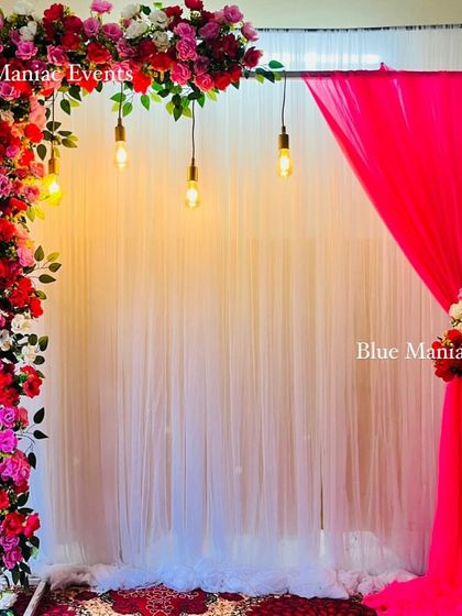 Another view of the colorful floral arch backdrop, perfect for any celebration.