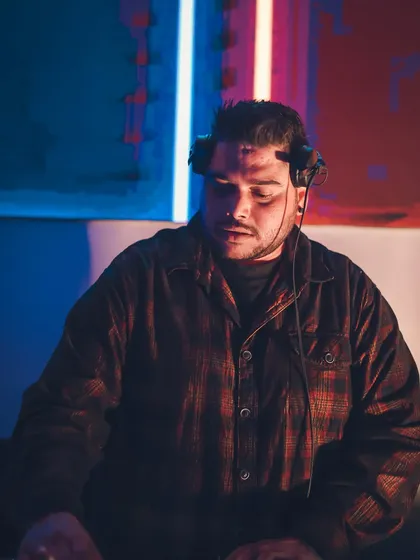 Your Vibe Curator. A close-up showing my focus as I blend sounds and create a unique atmosphere.