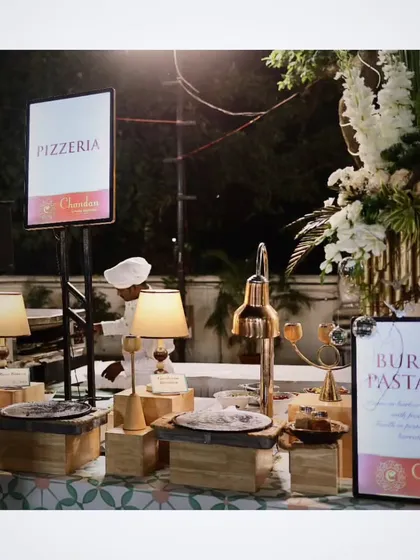 My Pizzeria and Burrata Pasta Bar stations, set up for an elegant evening event. I use stylish decor and lighting to make every food counter a visual highlight.