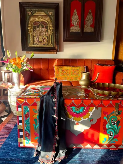 This hand-painted vintage trunk, reimagined as a vibrant coffee table, is the centerpiece of a home. It embodies my passion for giving old objects a new life, blending traditional Kalamkari and temple art motifs with functional design to create a true conversation starter.