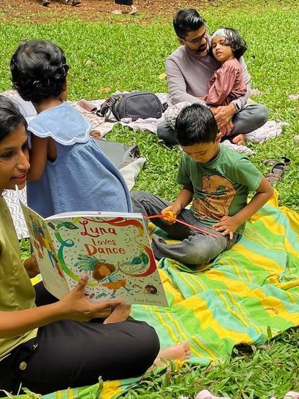 A parent from our community reads 'Luna Loves Dance' to the group. We encourage and welcome parents to step in and share their favorite stories.