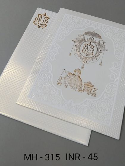A simple and elegant white invitation with a gold-foiled Ganesha and elephant motif. This affordable card is perfect for a classic and auspicious announcement.