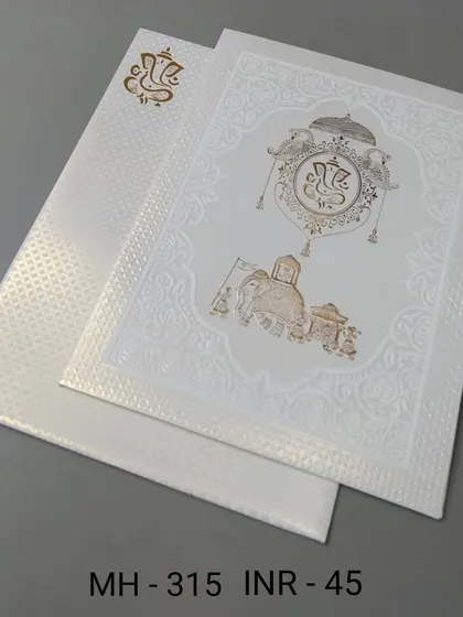 A simple and elegant white invitation with a gold-foiled Ganesha and elephant motif. This affordable card is perfect for a classic and auspicious announcement.