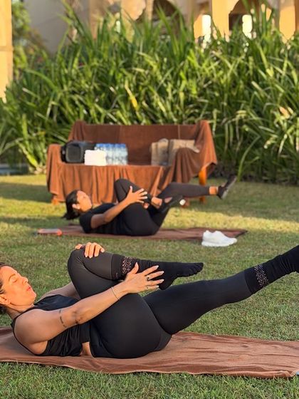 Pilates isn't just movement, it's how you reconnect with yourself. This photo from our outdoor retreat shows a moment of calm and core connection on the mat.