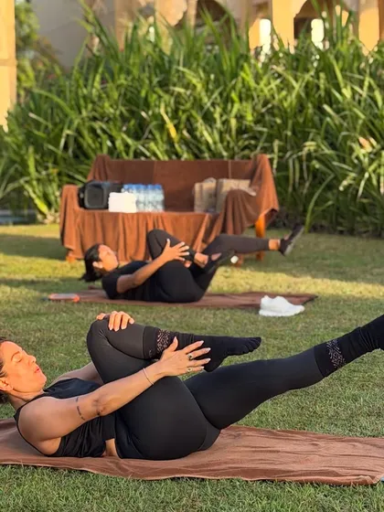 Pilates isn't just movement, it's how you reconnect with yourself. This photo from our outdoor retreat shows a moment of calm and core connection on the mat.