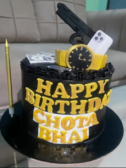 This "Chota Bhai" cake is all about the high life. The black and gold design is topped with edible models of a watch, an iPhone, cash, and a gun, making it a fun and edgy cake for a brother's birthday.