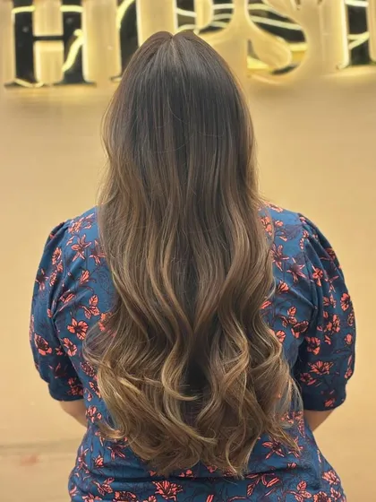 The back view of a stunning balayage, showing the full length and beautiful color gradient of the client's hair.