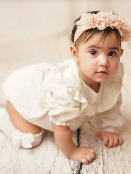 A curious expression from this little crawler. I love capturing the full range of emotions and expressions during a milestone shoot.