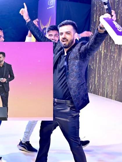 A high-energy moment celebrating with the award winners on stage.