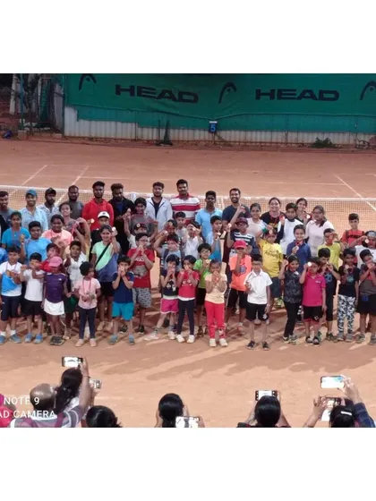 Our community is the heart of Tennis Temple. This group photo captures the diverse mix of kids, adults, parents, and coaches who come together to share their passion for the sport and celebrate at one of our events.