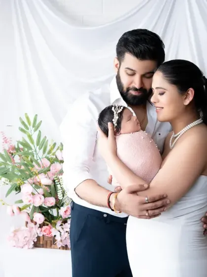A tender family portrait capturing the profound love and connection as new parents hold their baby for the first time. These are the quiet, heartfelt moments that form the foundation of your family's story.