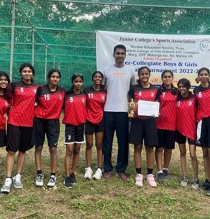 Another shot of the victorious girls team with their trophy and certificates, marking their achievement in the inter-collegiate basketball tournament.