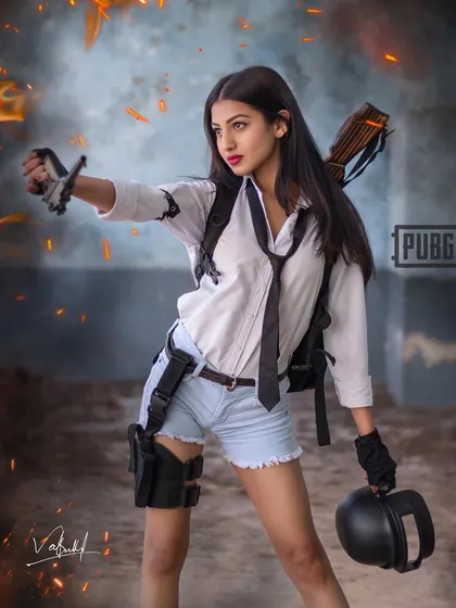 Capturing the 'Most Valuable Player' energy in our PUBG-themed shoot. The model holds a crossbow and helmet, ready for action, with editing that adds a gritty, fiery atmosphere to the scene.