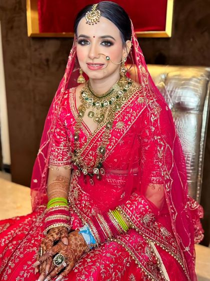 A seated portrait, capturing the bride's calm and happy demeanor on her special day.
