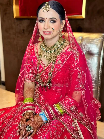 A seated portrait, capturing the bride's calm and happy demeanor on her special day.