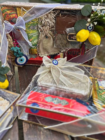 A collection of the Moroccan-themed Roka trousseau trays. The combination of transparent boxes, evil eye charms, and lemon motifs creates a stunning and cohesive display.