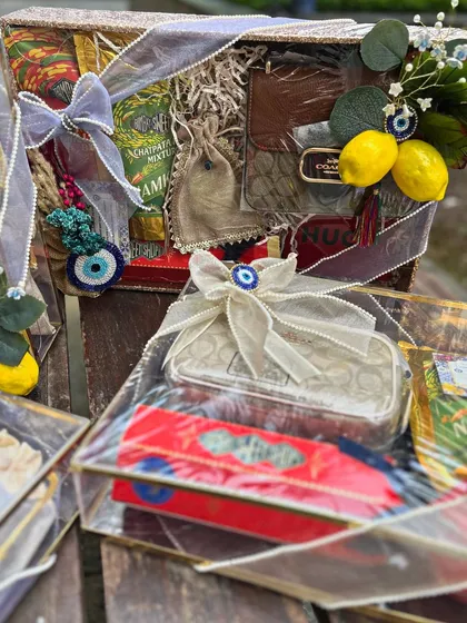 A collection of the Moroccan-themed Roka trousseau trays. The combination of transparent boxes, evil eye charms, and lemon motifs creates a stunning and cohesive display.
