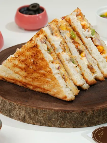 This classic vegetable sandwich is a staple for many cafes. We style it to look hearty and full, with all the layers visible, making it an easy choice for a quick lunch order.