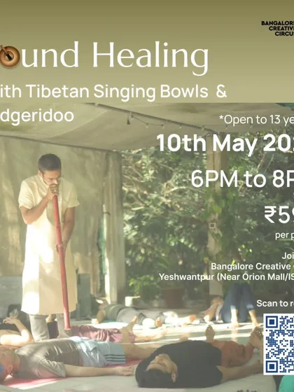 Find your moment of calm. This image captures the serene atmosphere of our Sound Healing session, where participants relax to the resonant frequencies of Tibetan singing bowls and the Didgeridoo, helping to release stress and restore balance.
