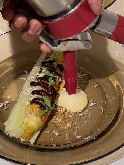 Adding a corn espuma to a creative dessert inspired by Mexican elote. This technique infuses intense flavor in a light foam.