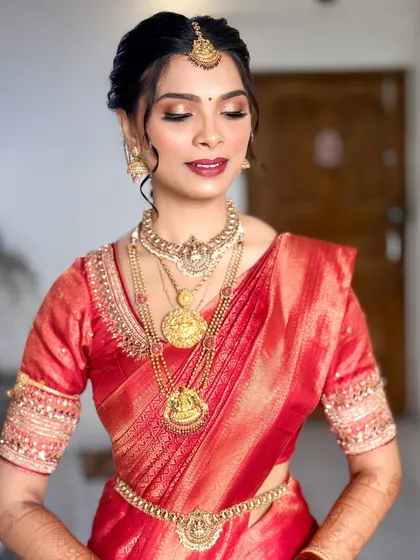 A close-up showing the shimmering gold eyeshadow and flawless skin finish. This look is all about timeless elegance.